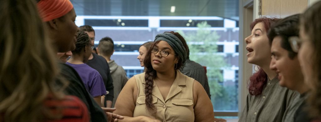 Graduate Students conversing at a coffee break during a seminar