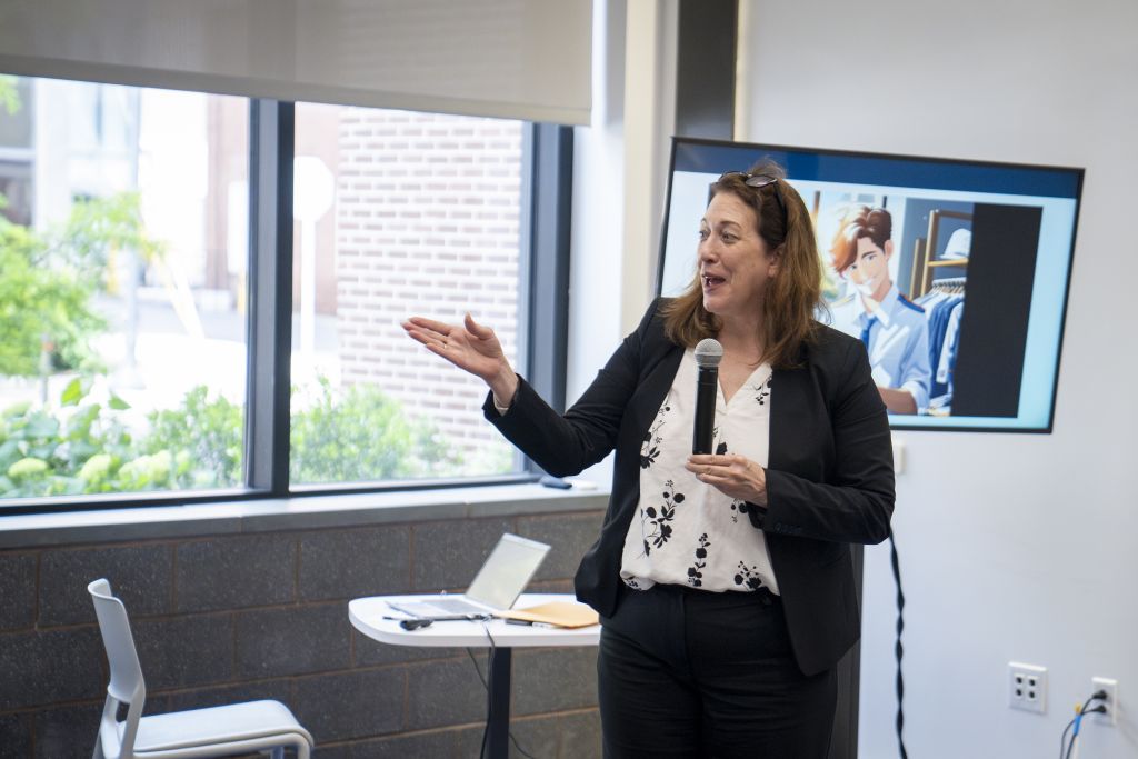 A professional woman presenting at the Bootcamp