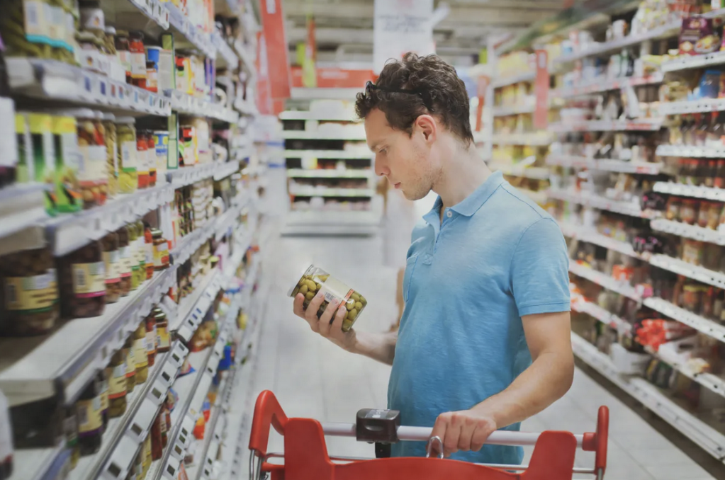 Stock image of a man in the grocery store