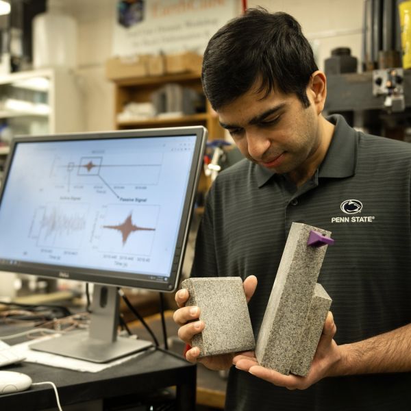 First author Prabhav Borate, a graduate student in engineering science, demonstrates how lab earthquakes are created: by grinding two blocks of rock together until a failure occurs. Credit: Poornima Tomy / Penn State. All Rights Reserved.